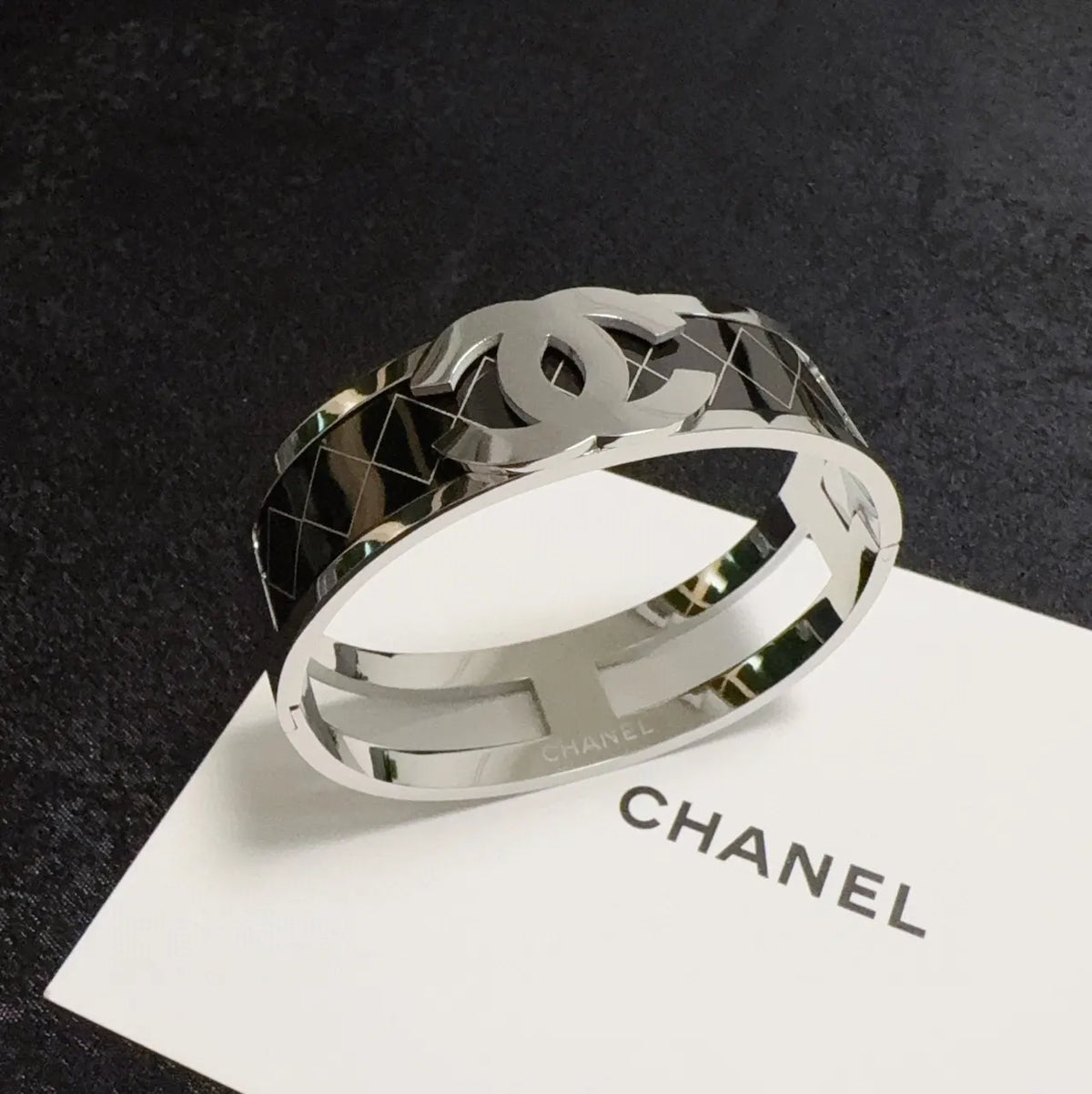 Silver-Tone Logo Bracelet on Wrist - Hình 3